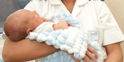 Someone Holding A Baby