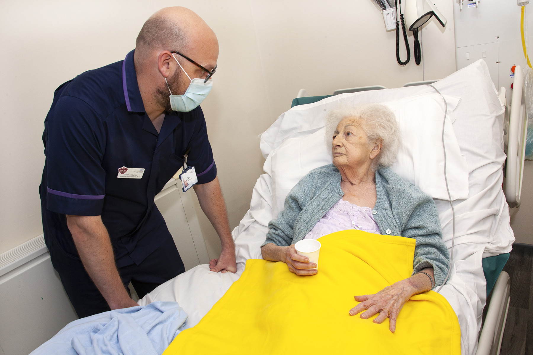 Bright yellow blankets and slippers aid in fall prevention at the Trust