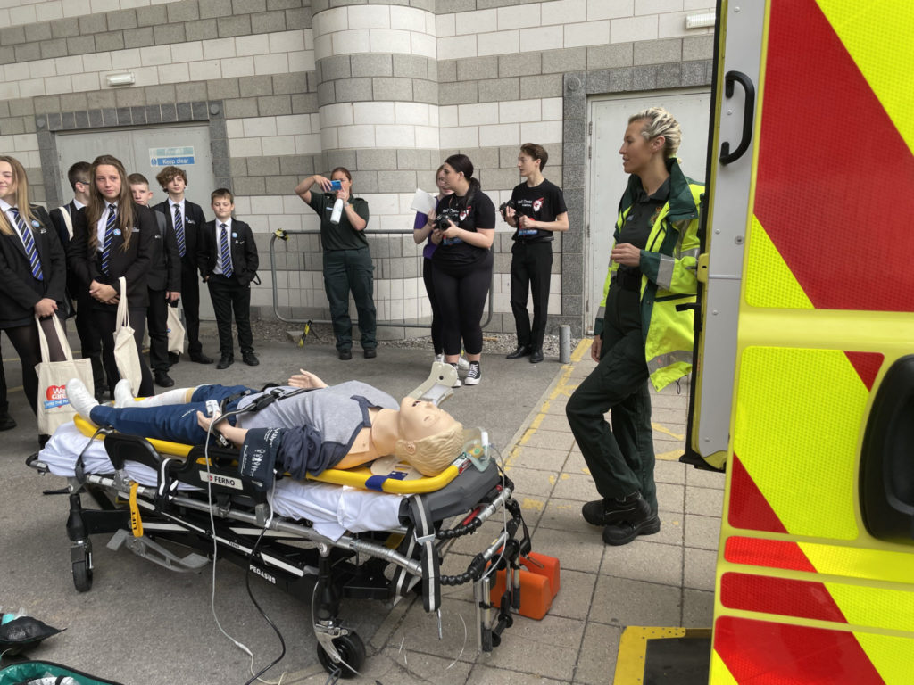 tudents watching a demonstration by the Ambulance team