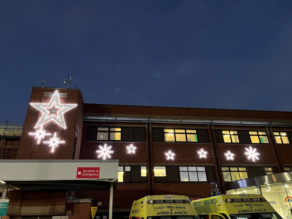 Christmas star illuminations of varying sizes and shapes are fixed to the wall above the Bassetlaw emergency department