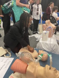 Getting hands on with the CPR resuscitation model.